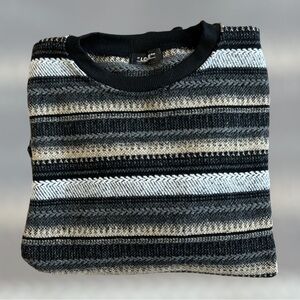 Neutral colored striped one pocket sweater